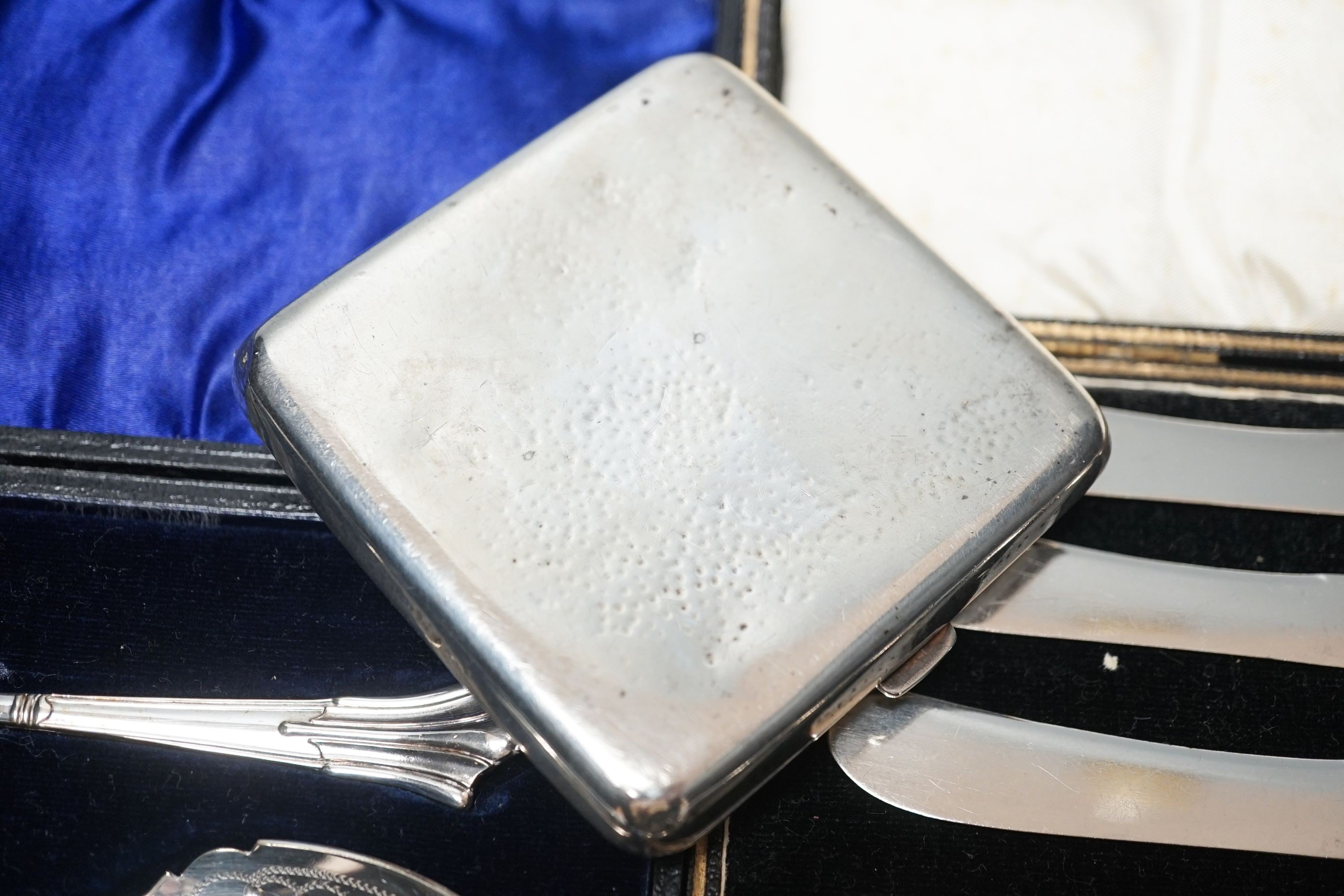 Four cased sets of cutlery including silver teaspoons and pair of silver preserve spoons and a silver cigarette case.